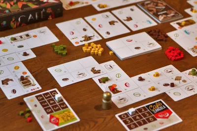 All components of Cafe, including coffee cards, supply tokens, and action markers.