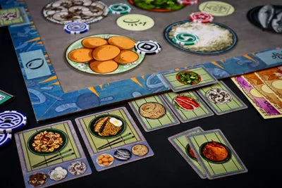 All components of Hibachi: Fired Up!, including chips, ingredient tokens, recipe cards, and play money.