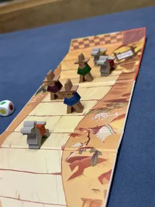 Players rolling dice and moving mules in Stubborn Mules, the strategic family racing game.