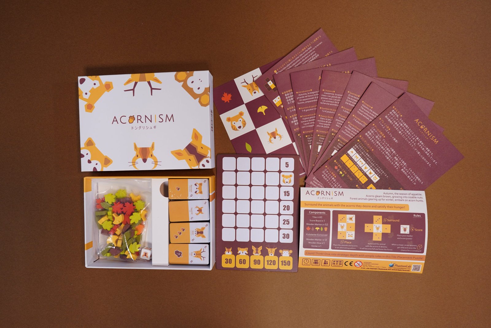 All Acornism components including animal tiles, acorn pieces, and leaf tokens.