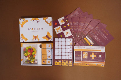 All Acornism components including animal tiles, acorn pieces, and leaf tokens.