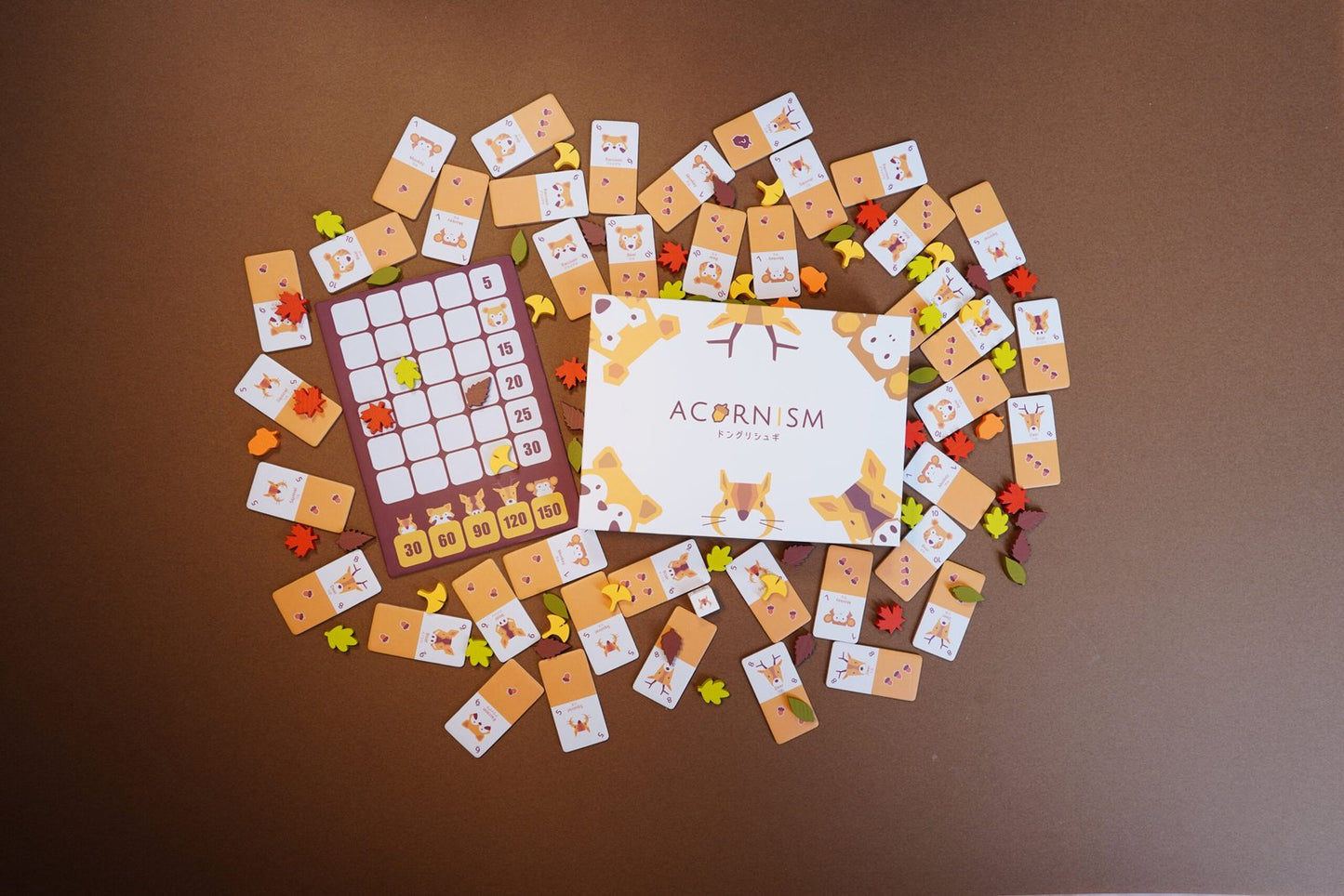 Players strategically placing tiles and scoring animals during a game of Acornism.