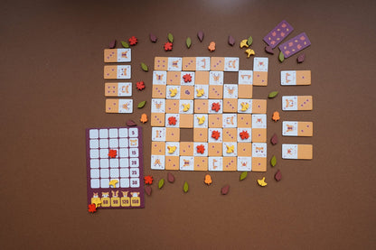 Acornism prepared for play with animal and acorn tiles placed on the board.