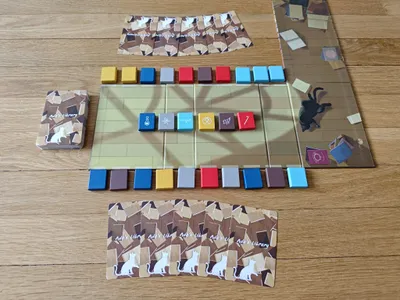 Players swapping and arranging books in Ada’s Library, the abstract bookshelf card game.