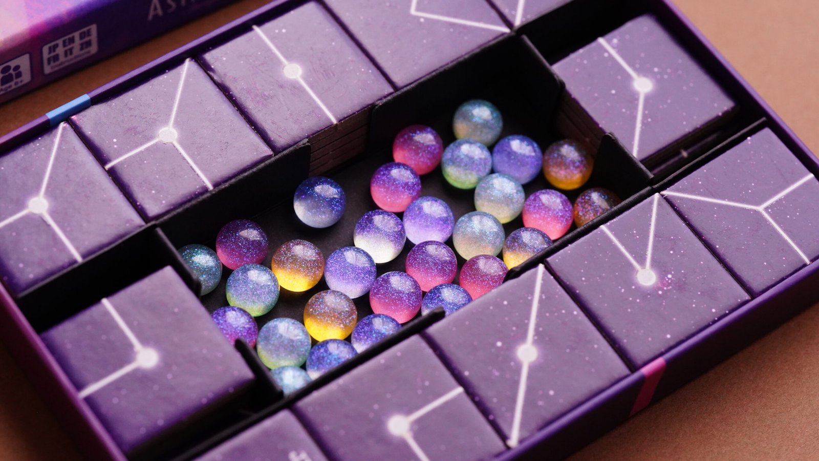 All Astraios: Starlight components including star tiles, nebula markers, and player boards.