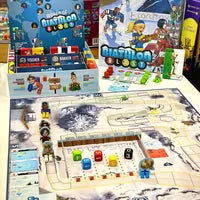 All components of Biathlon Blast, including athlete cards, dice, race track, and markers.