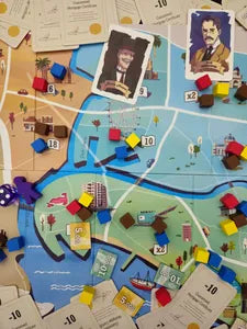 Players bidding, placing cubes, and controlling areas in Big Shot, the strategic auction game from Korea.