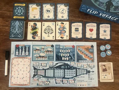 Flip Voyage game components — flip cards, player boards and sea maps