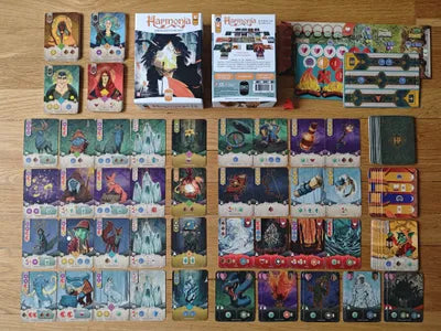 All components of Harmony, including adventure cards, relic tokens, player boards, and resource markers.