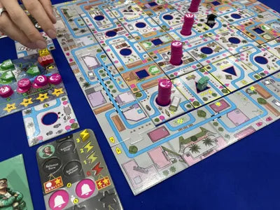 Players racing to pick up and deliver goods as Ojek drivers in Jakarta Traffic, the strategic city board game.