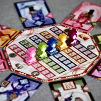 Players drafting cards and placing them in their album pyramid in Kimono Memories, the two-player pattern-building strategy game.
