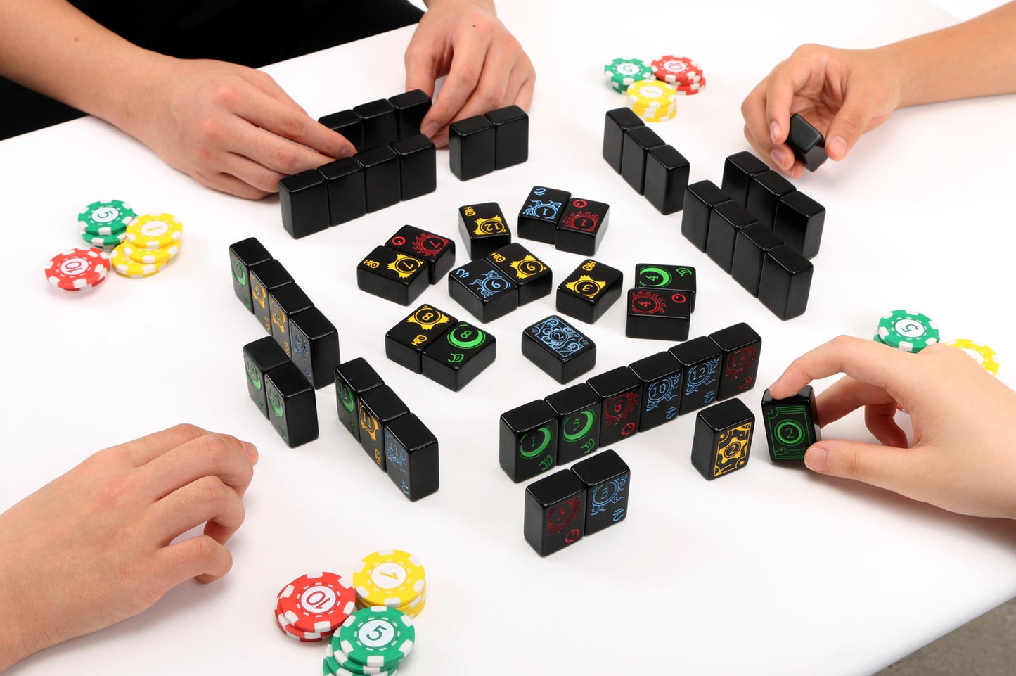 All components of Lexio, including sun, moon, star, and cloud tiles, and scoring chips.