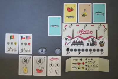 Lata arranged for play with boards, tokens, and disks ready for bidding and production.