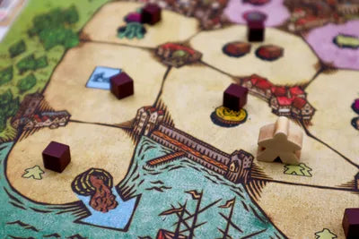 Players moving waste, recruiting workers, and building their sanitation empires in Night Soil, the mature strategy board game.
