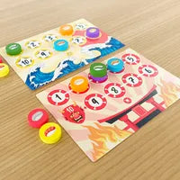 Players revealing Sushi and Ability cards during a round of Nightmares of Sushi.