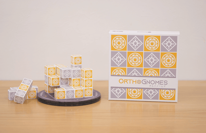 All OrthoGnomes components including cube blocks and reference cards.