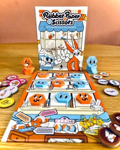 All components of Rubber Paper Scissors, including duel cards, squad tokens, and shop window board.