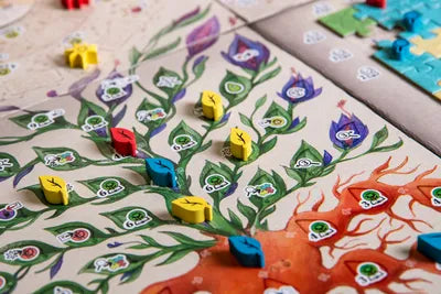 Players deciphering pages and unlocking secrets in The Voynich Puzzle, the cooperative manuscript board game.
