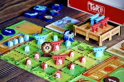 All Torii components including wooden Torii gates, spirit tokens, action tiles, and board.